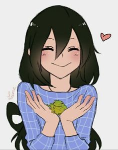 a girl holding a frog in her arms