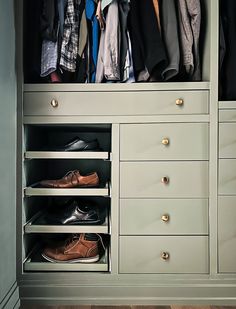 an organized closet with shoes and clothing