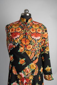 The Rang-e-Kashmir Aari Embroidered Jacket is a riot of colors that highlights the exquisite craftsmanship of Kashmiri artisans. With its vibrant floral patterns meticulously hand-embroidered to cover the back and cascade down the front, this jacket speaks to the joy and vibrancy of traditional Kashmiri art. The vivid oranges, yellows, and greens pop against the deep black fabric, giving it a regal, festive appeal. Perfect for special events or celebrations, this jacket adds a bold splash of col Kashmiri Art, Embroidered Rug, Scarf Jacket, Aari Embroidery, Silk Carpet, Traditional Attire, Pashmina Shawl, Embroidered Bag, Pashmina Scarf