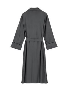 LAST ORDER FOR CHRISTMAS DELIVERY IS 12TH DECEMBER. ORDERS AFTER THIS DATE WILL BE POSTED FROM 6TH JANUARY. A chic silk robe in a sophisticated dark grey. Full length with slim piping detail and complete with two side pockets. Made in the UK from organic bamboo silk, the robe has a loose belt and fabric covered buttons so that you can cinch the silk dressing gown in at the waist. Perfect for slow mornings and days lounging at home. Finish off the look with the designers matching silk pyjama set. Long Silk Robe For Daywear, Elegant Belted Robe With Kimono Sleeves, Elegant Belted Silk Kimono, Elegant Silk Belted Kimono, Elegant Silk Robe With Tie Waist, Elegant Belted Kimono, Silk Pyjama Set, Silk Pyjamas, Silk Dressing Gown