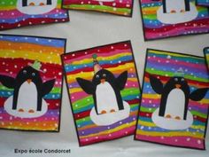 four cards with penguins painted on them and one has a party hat in the middle