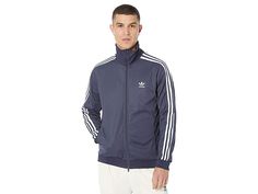 adidas Originals Beckenbauer Track Jacket - Men's Clothing : Shadow Navy : The primary materials that compose this product contain a minimum of 20 percent recycled content. An iconic classic that has been re-engineered for today's athlete, the adidas Originals Beckenbauer Primeblue Track Top will take you to the top of your game. The fabric is upgraded to Primeblue, a high-performance recycled material made with Parley Ocean Plastic containing at least 40% recycled material in total. Full fronta Mens Adidas, Track Jacket, Full Zip Hoodie, Track Jackets, Stripes Design, Puma Jacket, Adidas Men, Zip Hoodie, Adidas Jacket