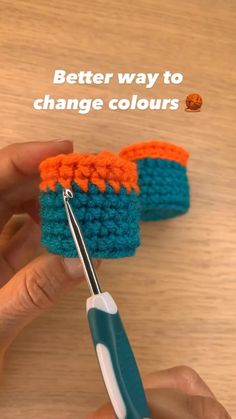 someone is crocheting something with scissors on the table and text reads, better way to change colours