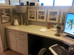 an office desk with a computer monitor and keyboard