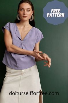 a woman in a purple top and white skirt with her hand on her hip, posing for the camera