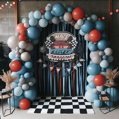 an entrance to a race themed party with balloons