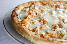 a pizza sitting on top of a glass plate