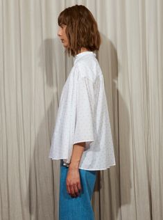 Effortless and relaxed gathered oversized shirt that slips on, made with an Italian cotton shirting fabric in a Fil Coupé dotted jacquard. We use the reverse side of the fabric that gives it a textured look but it is reversible to show a smoother look. Content: 100% Italian Cotton Model is 5'9" and wears a size S Made in NYC Also comes in BLUE Complimentary Shipping Worldwide Shirting Fabric, Popover Shirt, Oversized Shirt, Shirt White, Bell Sleeve Top, Ruffle Blouse, Product Launch, Slip On, Women's Top