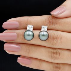 Product Details The fabulous Tahitian Pearl Simple Stud Earrings will make you the showstopper at your events and fill your day with heart-melting compliments. Embellished with a Round Shape Tahitian Pearl while Baguette and Round Shape Diamonds secured in Illusion Setting, embrace the phenomenal design. These Tahitian Pearl Earrings are an incredible choice to accentuate your look at your special events. Product Information SKU SHP-EARRINGS102026312 Width 10 mm Height 10.5 mm Weight 1.92 gm (Ap Tahitian Pearl Earrings, Simple Stud Earrings, Heart Melting, Tahitian Pearls, Baguette Diamond, Tahiti, Round Shape, Special Events, Pearl Earrings