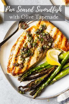 pan seared swordfish with olive tapenad and asparagus on a plate