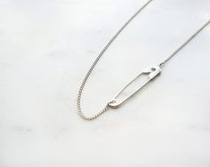 Safety pin necklace, Silver Safety Pin charm, layering necklace, minimalist necklace, love LUCKY necklace, cool gifts for Christmas++FREE worldwide SHIPPING++Made of high-quality Silver plated brass base.* Nickel freeTotal length: 16.5"size of pendant: 0.35" x 1.57"Safety pin- In Gold finish: https://www.etsy.com/uk/listing/647297318/safety-pin-necklace-safety-pin-charm?ref=shop_home_active_1&frs=1Item will arrive in pretty gift packaging, and you can ask us to add your personal note.Want to Minimalist Safety Pin Necklace For Everyday, Minimalist Safety Pin Jewelry As A Gift, Minimalist Safety Pin Jewelry For Gifts, Minimalist Safety Pin Jewelry As Gift, Cool Gifts For Christmas, Safety Pin Necklace, Lucky Necklace, Pin Necklace, Initial Necklace Silver