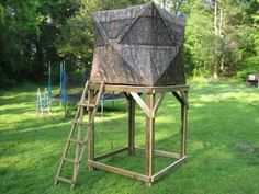 a wooden structure with a camouflage covering on it