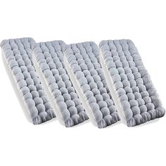 three mattresses sitting next to each other on a white surface