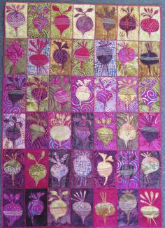 an art quilt made with various images of flowers and leaves in pink, purple, yellow and green