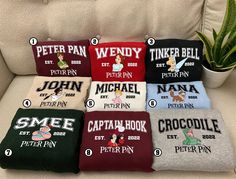 six personalized towels sitting on a couch with the names of their favorite cartoon characters