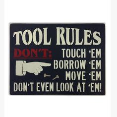 a sign that says tool rules don't touch'em borrown'em move'em don't even look at'em