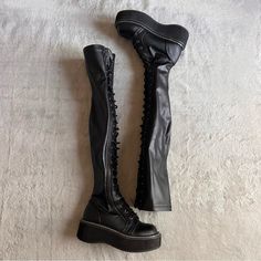 Good Used Condition. Emily 375 Thigh-High Boots By Demonia In Black. Goth Punk Club Aesthetic. Chunky Platform Flatform Lace-Up Boots Made From Black Stretch Vegan Leather, See Video. Over-The-Knee Silhouette. Side Zipper For Easy On/Off. Note: Light Wear With Streetwear To Bottom Sole, Scuffing At Bottom Heel And Outsole, Heel Drag, And A Few Minor Surface Marks, See Photos. Size 6, See Photos For Measurements. Goth Boots Aesthetic, Rick Owens Boots, Demonia Boots, Goth Boots, Club Aesthetic, Demonia Shoes, Clubbing Aesthetic, Black Goth, Goth Punk