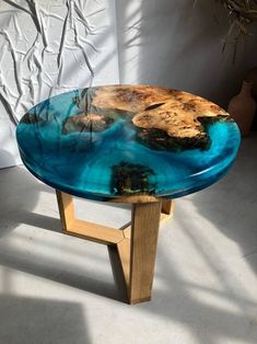 a table that has been made to look like it is floating in the ocean with blue water