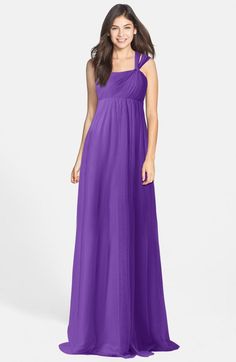 a woman in a long purple dress