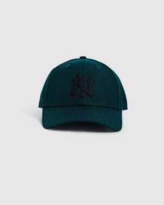 The 9Forty New York Yankees Cap by New Era comes in a dark green colourway. The hat is a cap style and features embroidered logo 'NY', signature branding and an adjustable rear. Yankees Cap, Destination Dress, Teen Shopping, Cap Style, A Cap, Jersey Top, Skirted Swimwear, New York Yankees, Denim Shop