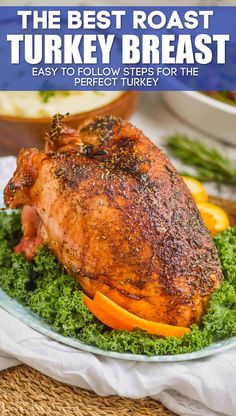 a whole chicken on a plate with oranges and greens