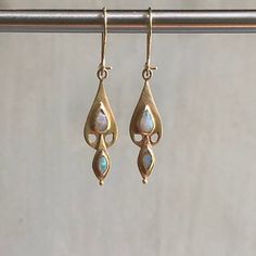 Tear drop and marquis shaped opal earrings set in 10k satin brushed gold shaped as a dove. Gold Opal Earrings, Creation Station, Earrings Opal, Opal Earrings, Tear Drop, Earrings Set, Dream Wardrobe, Earring Set, Opal