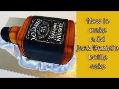 a cake that is shaped like a jack daniels bottle