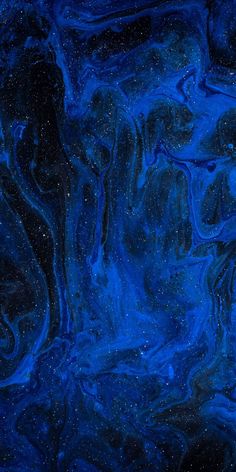 an abstract blue and black background with stars in the sky on it's surface