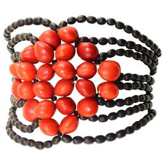 Tired of seeing the same plain jewelry everywhere? Looking for something original that will make you feel elegant, sophisticated, and gorgeous? This wrap bracelet for women designed by Amarno Women Artisans may be what you are looking for. Hand made in the Amazons of Perú with Medium size (8mm) natural Huayruro (why-ee-ru-ro) Peruvian bead, you won’t be just wearing a fashionable piece, but also some of Peru’s treasures and mysteries. The Legend Huayruro seeds are believed to bring positive ener Red Bohemian Cuff Bracelet As Gift, Bohemian Red Cuff Bracelet As Gift, Bohemian Style Red Cuff Bracelet As Gift, Handmade Adjustable Red Bangle, Red Handmade Adjustable Bangle, Adjustable Handmade Red Bangle, Red Beaded Bangle Bracelets, Unique Handmade Red Bracelet, Red Beaded Bangle Bracelet