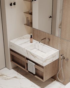 a bathroom with marble counter tops and wooden cabinets