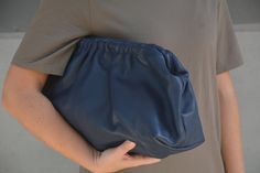 Indulge in luxurious functionality with our Cloudy Chic Leather Clutches collection! Crafted from genuine blue leather, each piece is meticulously handmade to perfection. Elevate your style with our extra-large dumpling retro puffball bags, designed to make a statement while providing ample space and durability. Whether you're heading to work or a night out, these oversized beauties are sure to turn heads. Embrace timeless elegance and practicality with our handmade creations, exclusively for wo Cloud Bag, Chic Leather, Bag Handmade, Leather Clutch, Clutch Handbag, Blue Leather, Evening Bags, Purses And Handbags, Blue Sky