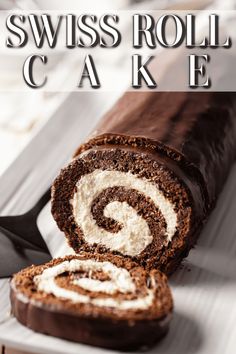 the swiss roll cake is cut in half and ready to be eaten with text overlay