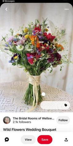 a bouquet of wildflowers tied up on a table