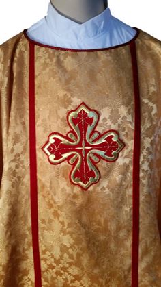 "Gold rayon brocade cross pattern fabric adorned with two 7\" crosses. 5/8\" red velvet trim. Red cording around neck. Lined with red polyester. This vestment is ready to ship and measures 46\" long and 50\" wide. This fabric and is available in purple and red. Custom order 4-6 weeks lead time. Please contact me to discuss your needs and ideas for vestments and altar linens. Customized to your style, size & budget. Ready to ship chasubles currently on sale." Red Embroidered Chasuble For Church, Velvet Trim, Cross Patterns, Extra Fabric, Pattern Fabric, Gold Cross, Red And Gold, Lead Time, Fabric Patterns