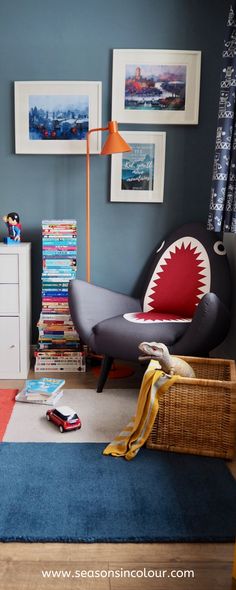 a living room filled with furniture and pictures on the wall