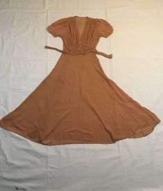 "1930s dress handmade gauze synthetic side zip smock shoulder short sleeve v front button back waist band unlined, sem-transparent gorgeous piece w/wear as is w/some holes throughout, mostly shirt, and a few small ones in folds of skirt, great fixer or sample measures, lying flat, shoulder-12\" sleeve-9\" chest-19\" waist-15\" top to waist at side-13\" length-54\" about calf to ankle length, depending on wearer's height" Solid Color Fitted Knee-length Vintage Dress, Beige Vintage V-neck Dress, Vintage V-neck Dress For Vintage Events, Vintage V-neck Dresses For Vintage Events, Fitted Vintage Dress In Solid Color, Summer Vintage Dress With V-neck, Solid Color Vintage Summer Dress, Vintage Brown Lined Dress, Fitted Short-sleeved Vintage Dress For Daywear