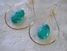 Large handcrafted gold hoop earrings fashioned into a teardrop shape and accented with a bold Turquoise briolette in the center. These lovely statement earrings are handcrafted from 14k gold filled metal, shaped and hammered for shine and texture. The teardrop shape highlights the bold Turquoise gemstone that hangs in the center for a one of a kind statement look. Earring Length 3.5 inches Earring Width at the base 2 inches Threaded Turquoise Necklace: http://www.etsy.com/listing/637197368 LINKS Turquoise Hoop Gemstone Jewelry, Turquoise Gemstone Hoop Jewelry, Turquoise Hoop Pierced Earrings, Nickel-free Teardrop Turquoise Hoop Earrings, Nickel-free Turquoise Teardrop Hoop Earrings, Turquoise Teardrop Nickel-free Hoop Earrings, Teardrop Turquoise Nickel-free Hoop Earrings, Turquoise Wire Wrapped Hoop Earrings Gift, Turquoise Teardrop Hoop Earrings Nickel Free