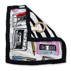 a black and white blanket with an old fashioned tape recorder on it