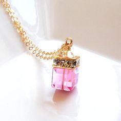 Give a girly pink gift to a woman who loves sparkly, girly and classic elegant jewelry. This Swarovski crystal necklace features a pink colored crystal which mimics the precious gemstone pink topaz. Perfect gift for a woman born in October since pink topaz is one of their birthstones.Swarovski crystal cube pendants come in all birthstone colors and neutrals. Give an elegant yet personal gift to all the women in your life. Adjustable necklace for the perfect fit every time.Necklace Details:- Pend Pink Topaz Necklace, Minimalist Wedding Jewelry, Time Necklace, Cube Pendant, Born In October, Bridal Party Jewelry, Cube Necklace, Topaz Crystal, October Birthday