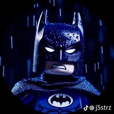 the lego batman movie character is shown in a dark room with stars on his chest