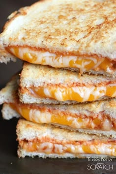 four grilled cheese sandwiches stacked on top of each other