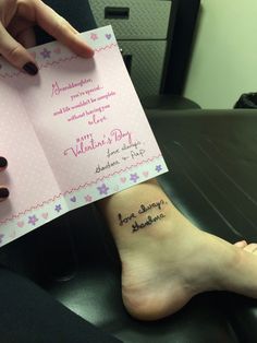 a woman's foot with a small tattoo on her left ankle that reads, happy valentine's day