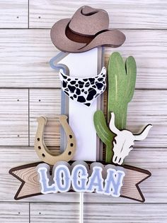 a wooden sign that says local with cowboy hats on it and a cowgirl's boot