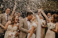 a bride and groom are surrounded by confetti