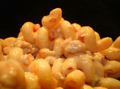 macaroni and cheese is piled high on top of each other