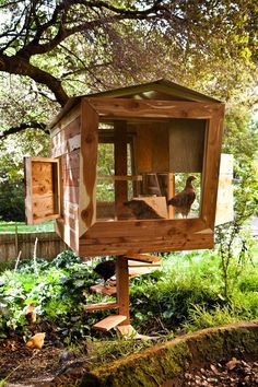 a bird house built into the side of a tree