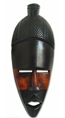 an african mask is shown against a white background