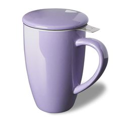 a purple coffee mug with a white lid