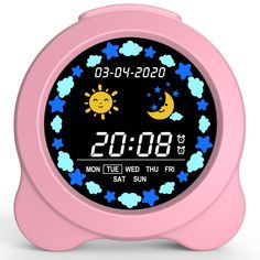 a pink alarm clock with the moon and stars on it