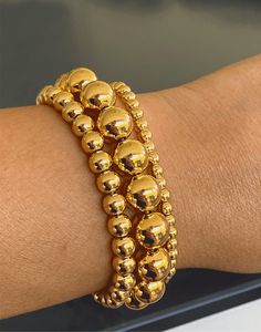 "Adjustable Slider Bracelet with 6mm Beaded Balls in 18k Gold-Filled We offer this item in Two finishes : Gold and Silver (White Rhodium) .Product Specification: Clasp Type : Adjustable (Elastic) Length in inches / cm : 9\" / 21cm Weight in Oz : 0.20 Finish : Gold Filled 18k" Slider Bracelet, Bracelet Bead, Gold Bead Bracelets, Solid Gold Jewelry, Jewelry Cleaner, Gold Filled Jewelry, Gold Beads, Cable Chain, Statement Jewelry